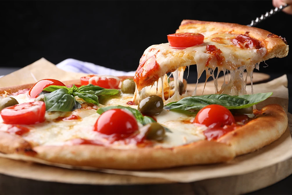 a pizza with tomatoes and olives