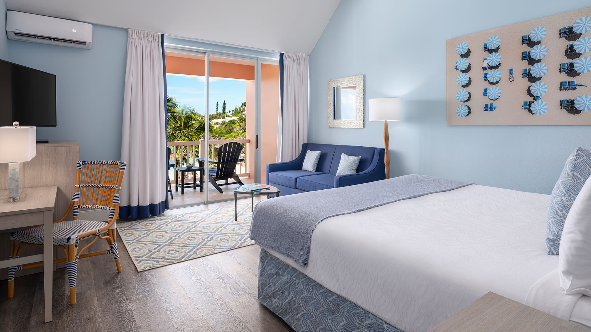 a bedroom with a large bed and a large window