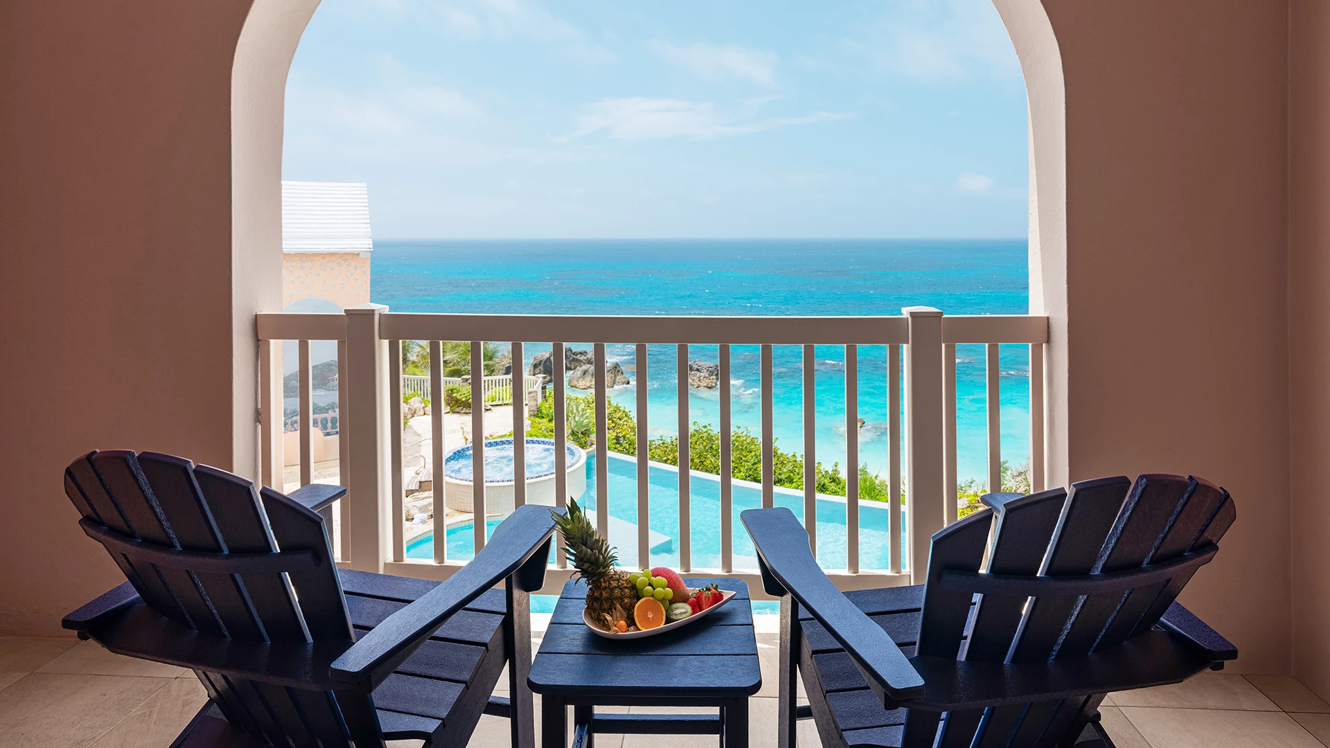 a table and chairs on a balcony