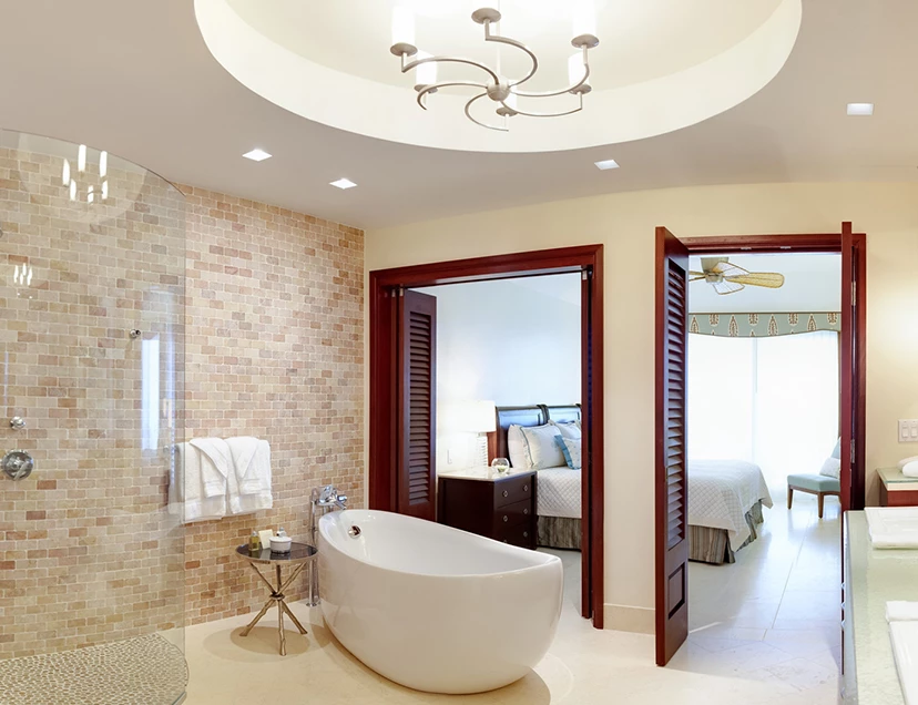 a bathroom with a tub and shower