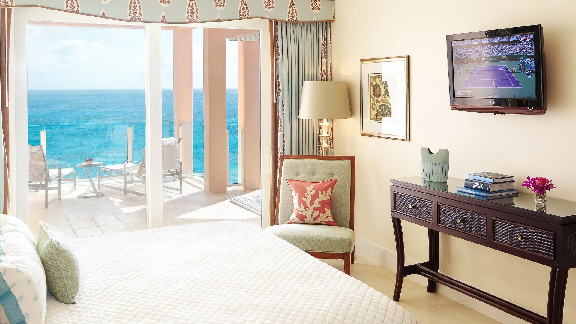 a bedroom with a bed and a table and a lamp