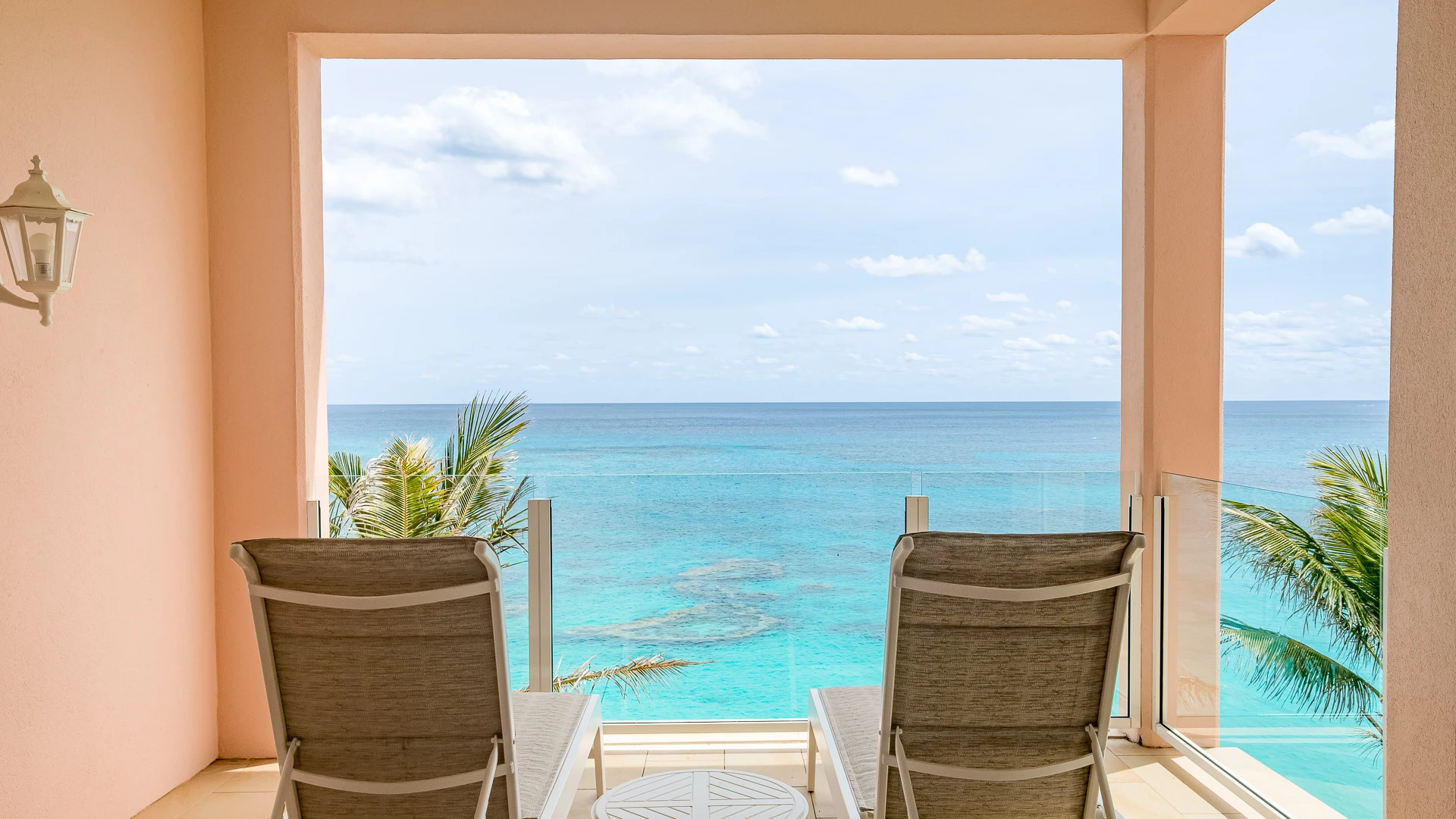chairs on a deck overlooking the ocean