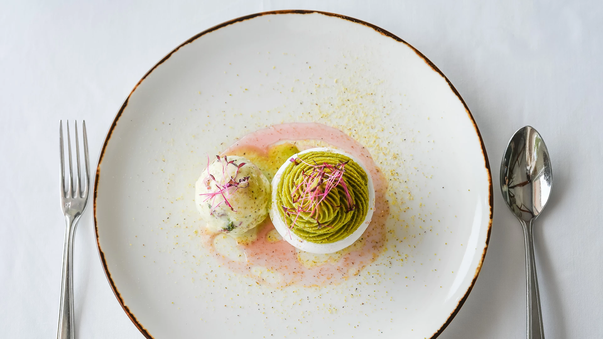 a plate of food on a white surface