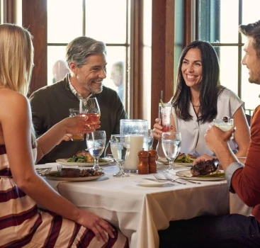 a group of people sitting at a table