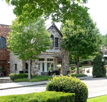 a building with trees and bushes