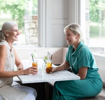 two women sitting at a table