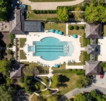 a swimming pool surrounded by trees