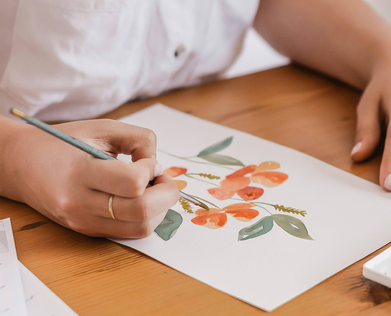 a person drawing a picture with a pencil