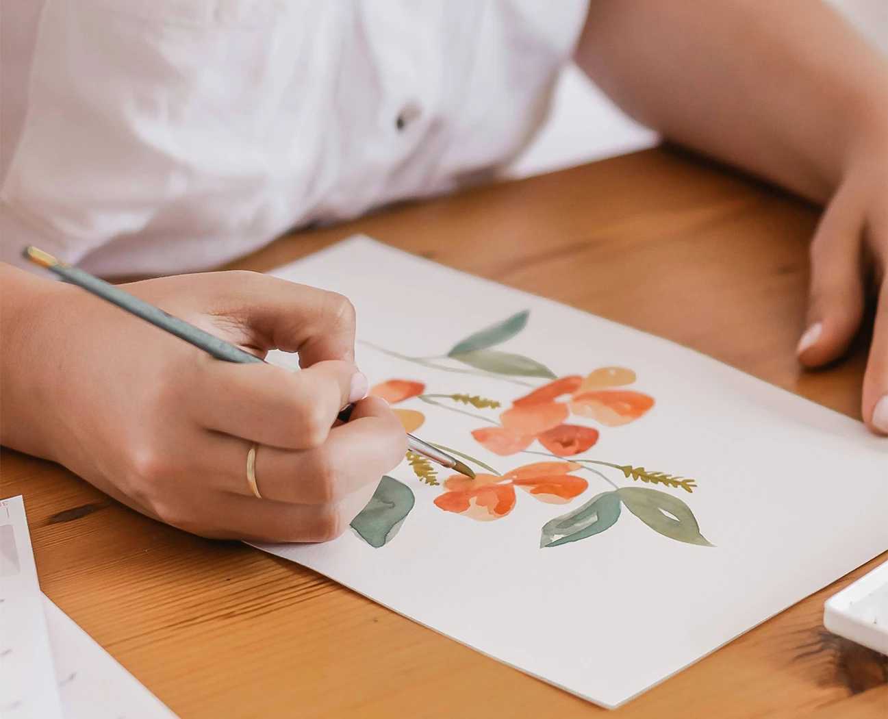 a person drawing a picture with a pencil