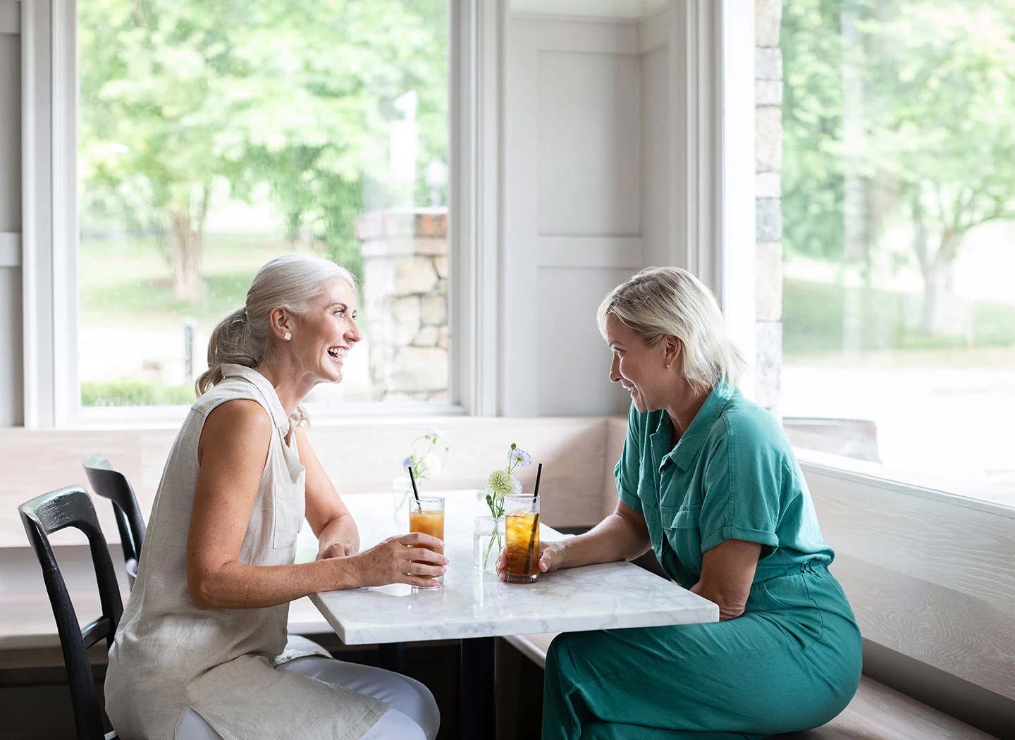 two women sitting at a table