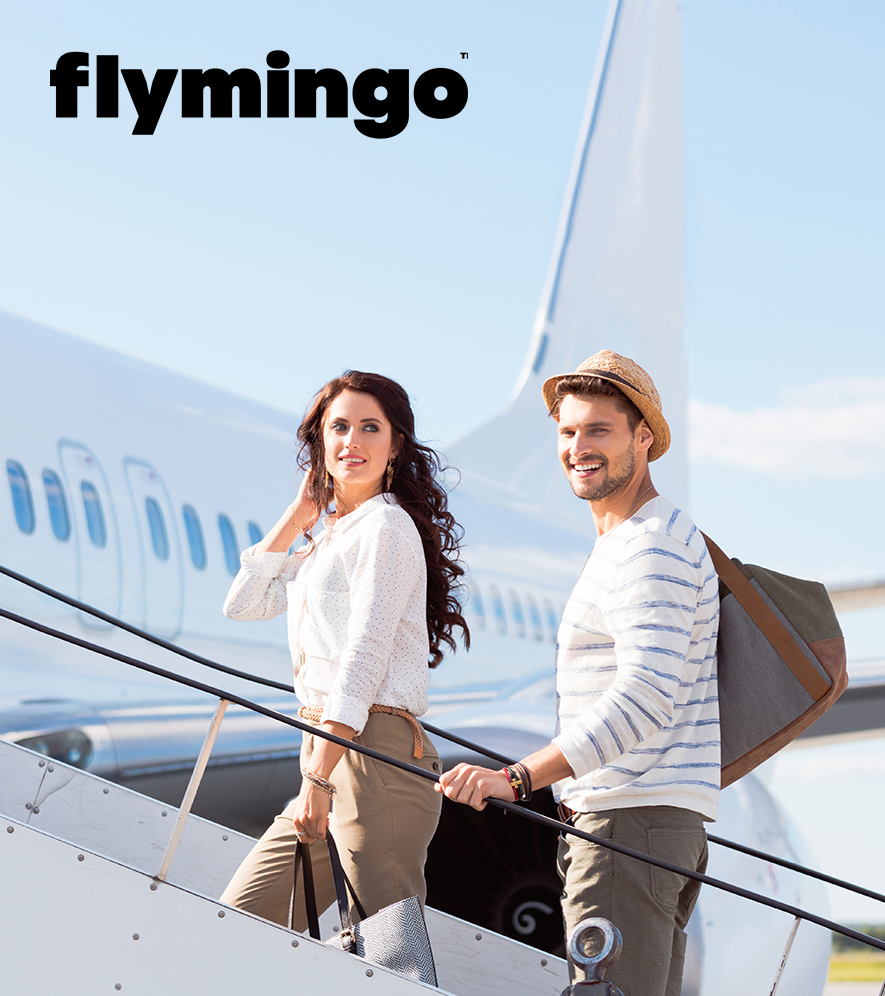 a man and woman standing on a plane
