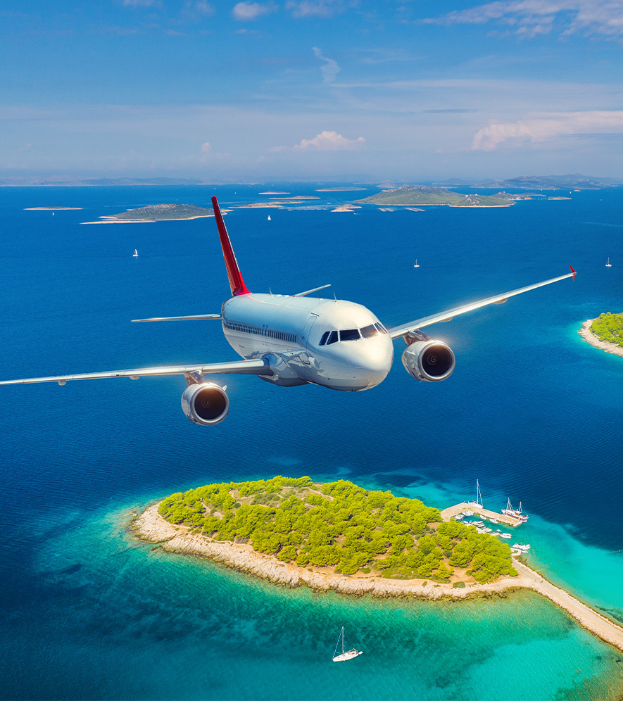 an airplane flying over an island