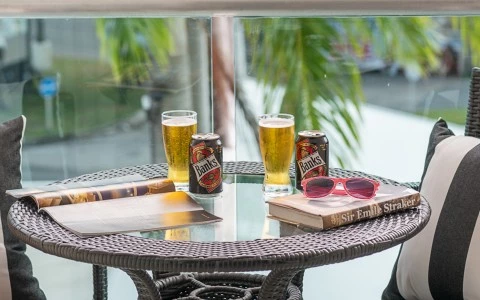 a table with drinks and glasses on it