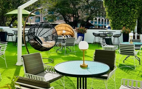 a patio area with chairs and tables