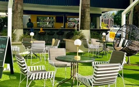 a patio area with chairs and tables