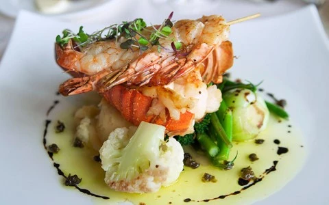 a lobster dish with vegetables