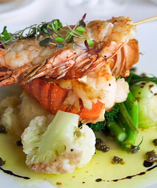 a lobster dish with vegetables