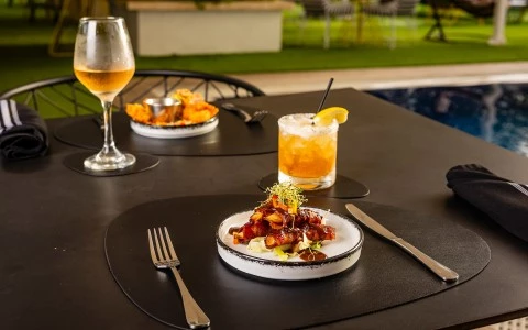 a plate of food and a drink on a table