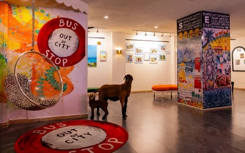 a goat and a baby in a room