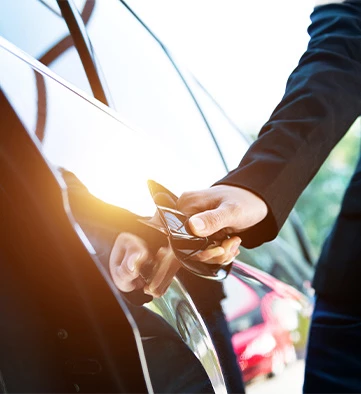 a person opening a car door
