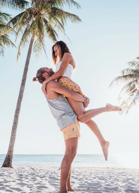 a man holding a woman