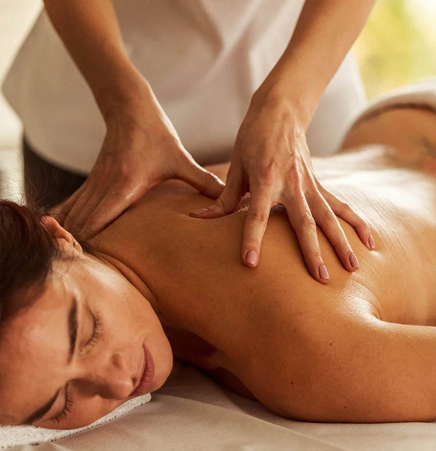 a woman lying down on a massage table
