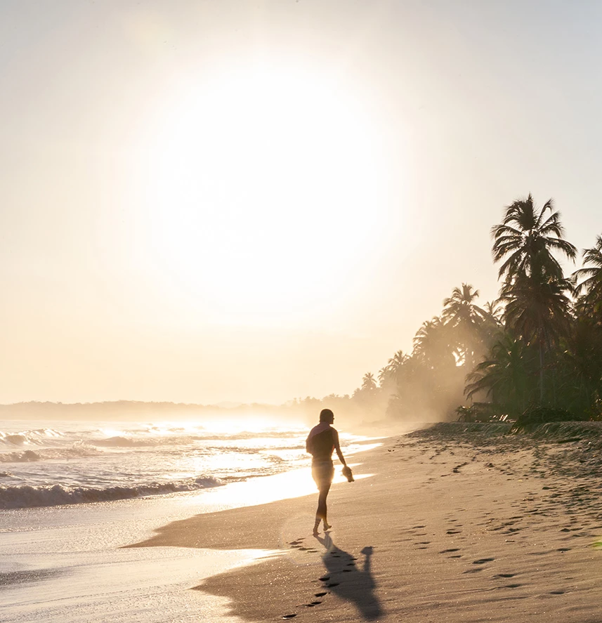 a person walking on a beach