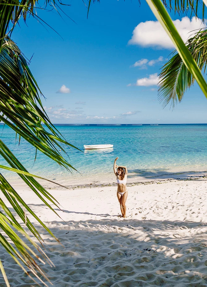 a woman in a garment on a beach