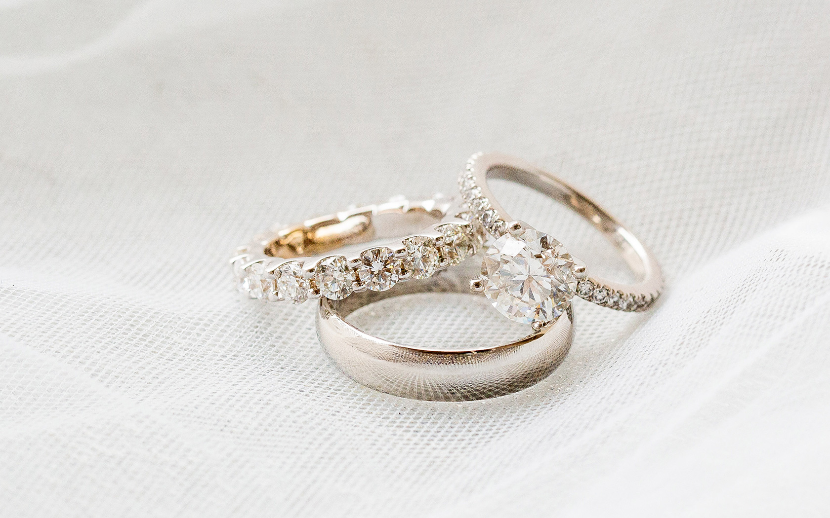 a stack of rings on a white fabric