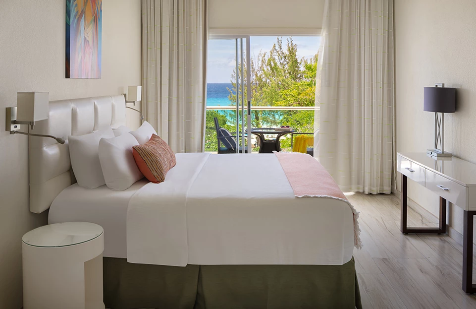 a bed with a view of the ocean
