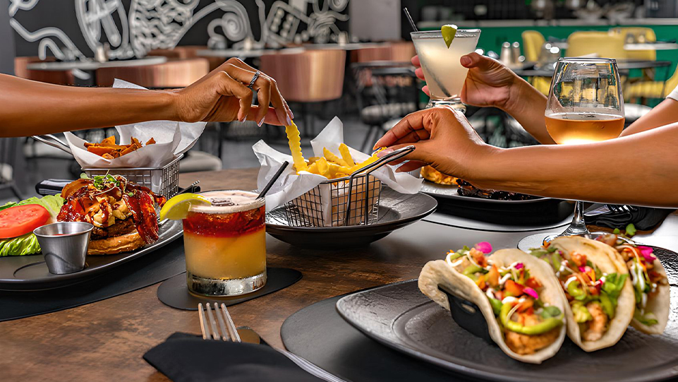 a group of people eating at a restaurant