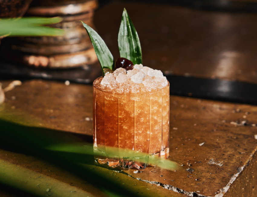 cocktail with cherry and tequila on a table