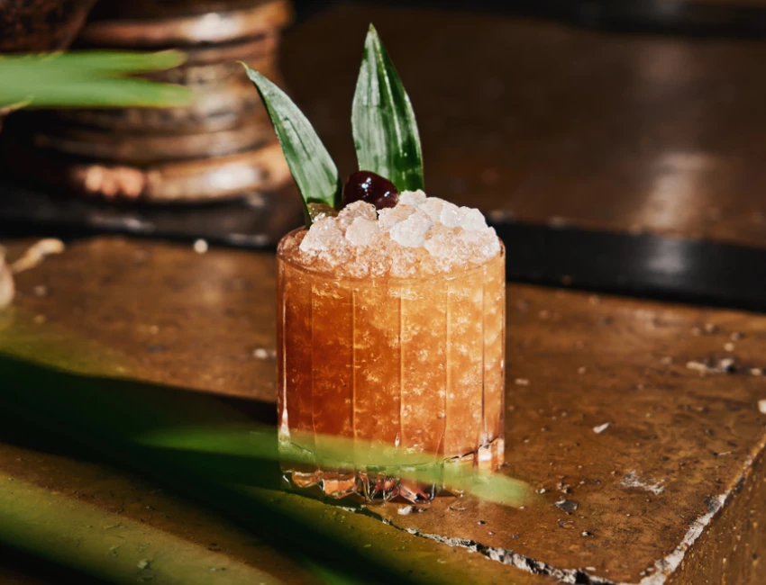 cocktail with cherry and tequila on a table