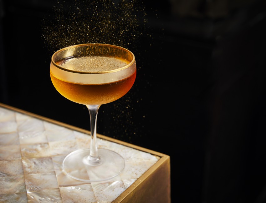 gold martini on a marble countertop