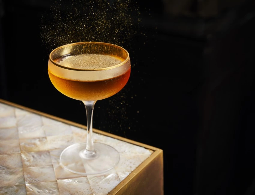 gold martini on a marble countertop