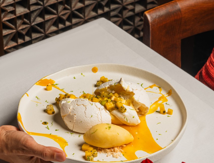 tropical pavlova with passion fruit curd