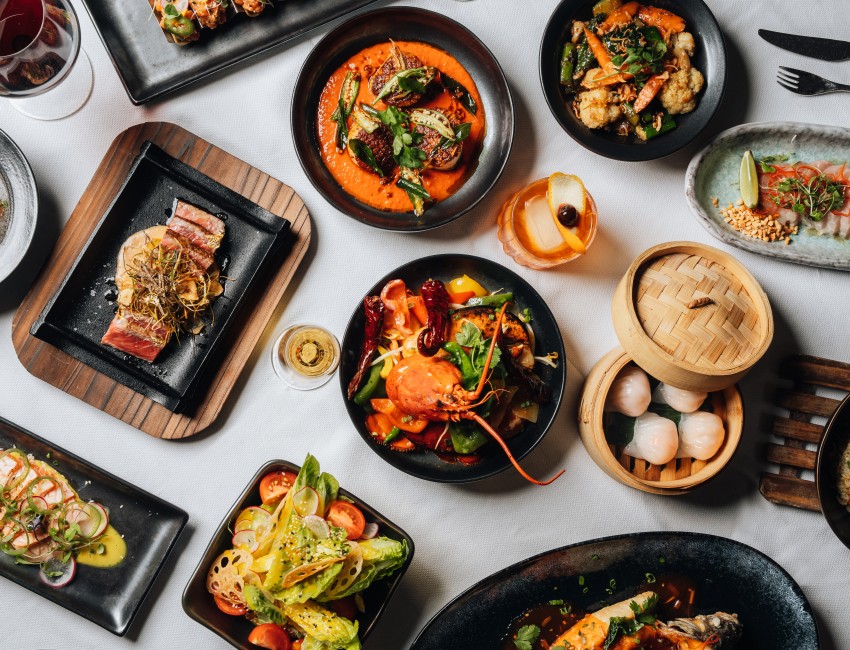 flatlay of Asian dishes on white tablecloth