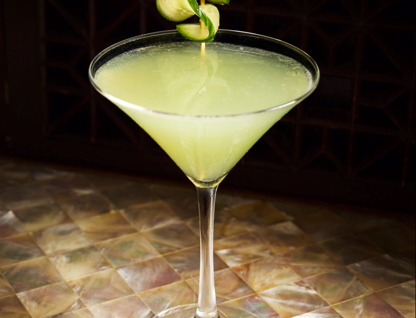 a glass with a drink on it