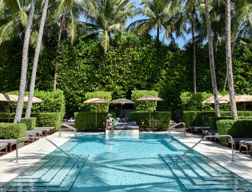 a woman sitting in a pool