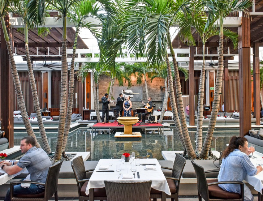 a group of people playing music in a pool
