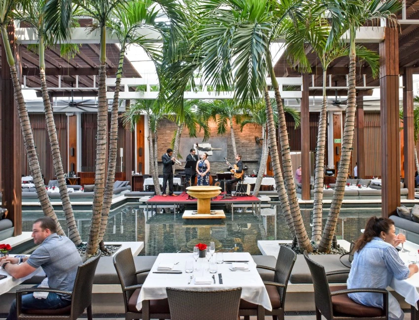 a group of people playing music in a pool