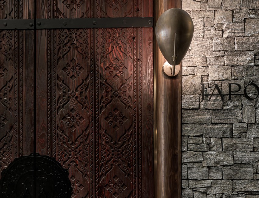 a wood door with a light on the side