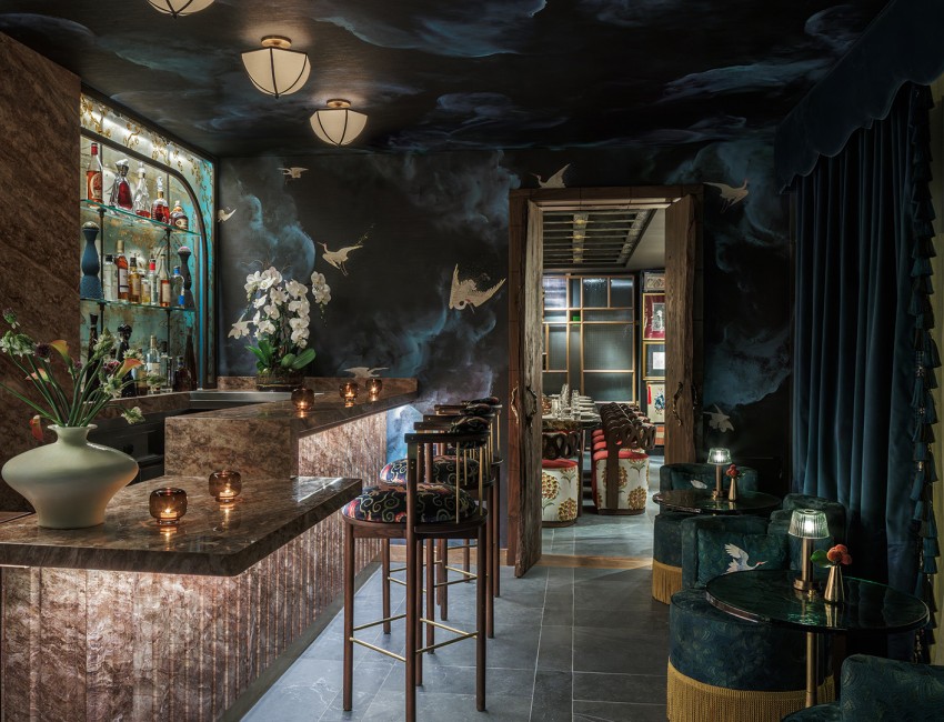 a bar with a bar counter and stools