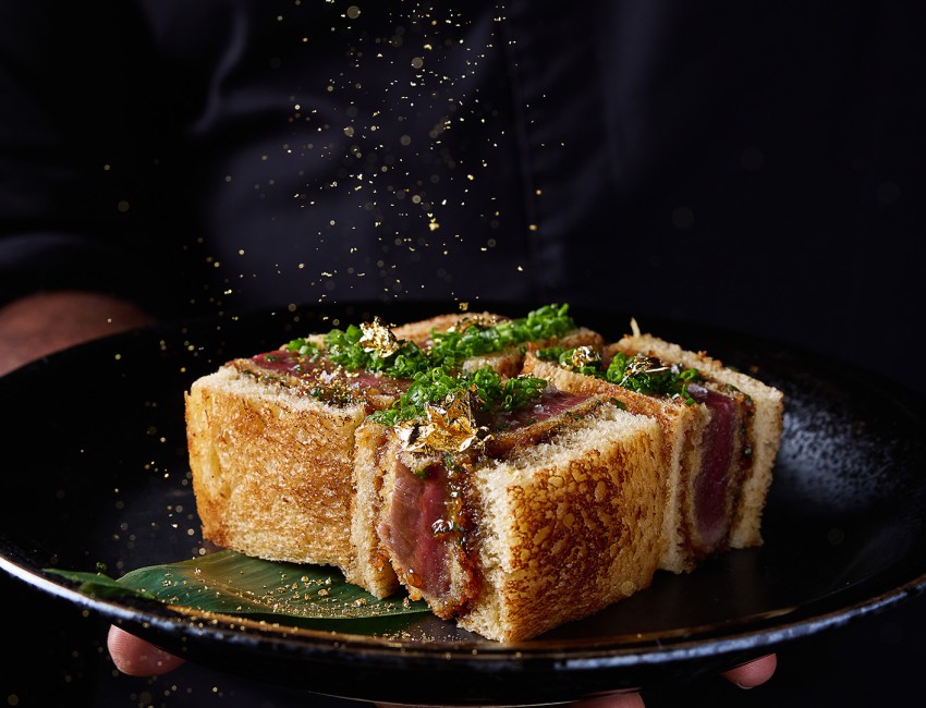 a plate of food with gold sprinkles