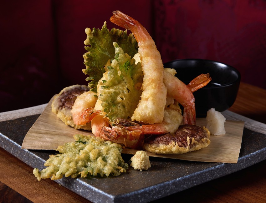 a plate of fried shrimp and vegetables