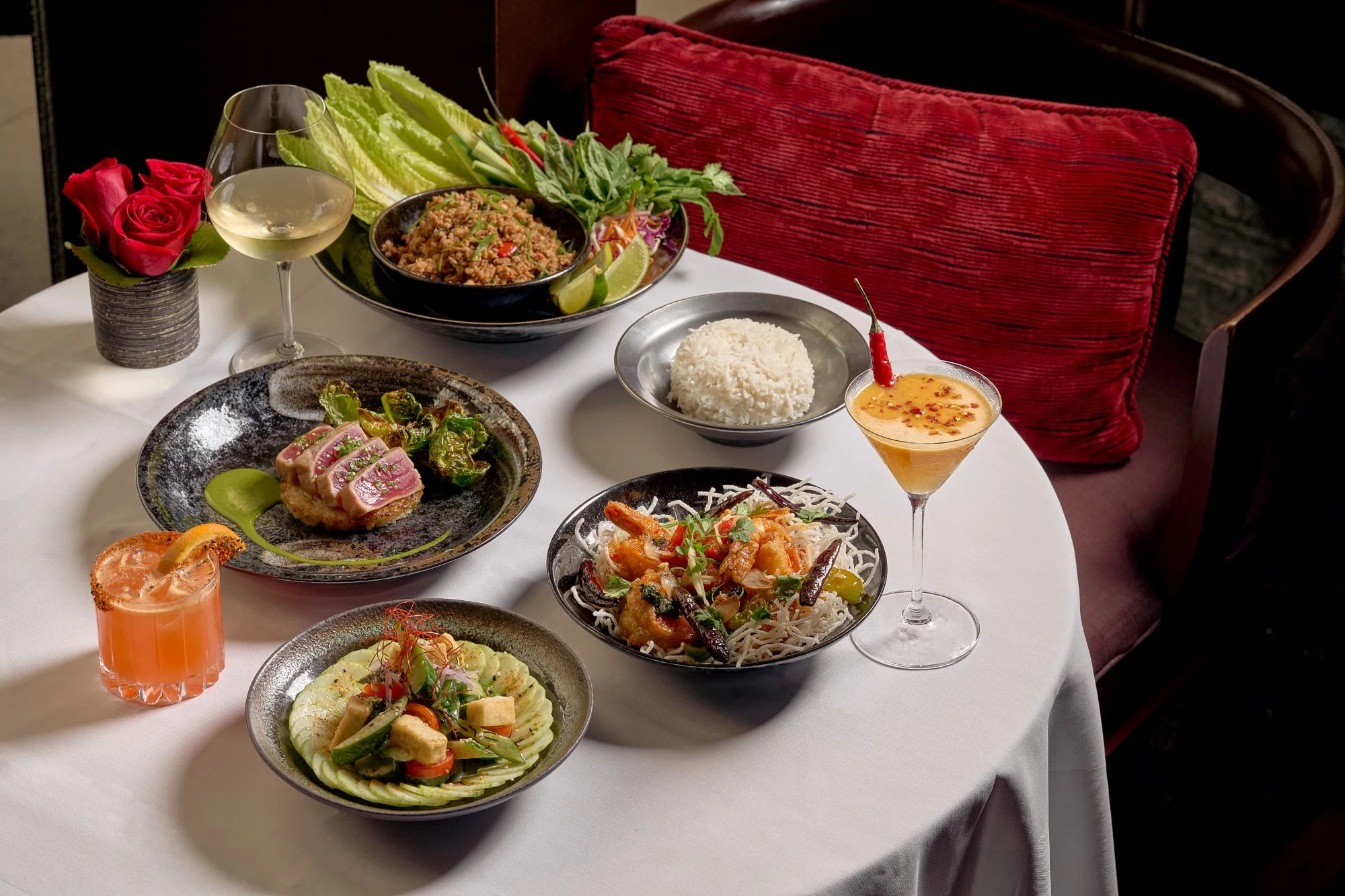 a table with plates of food and drinks