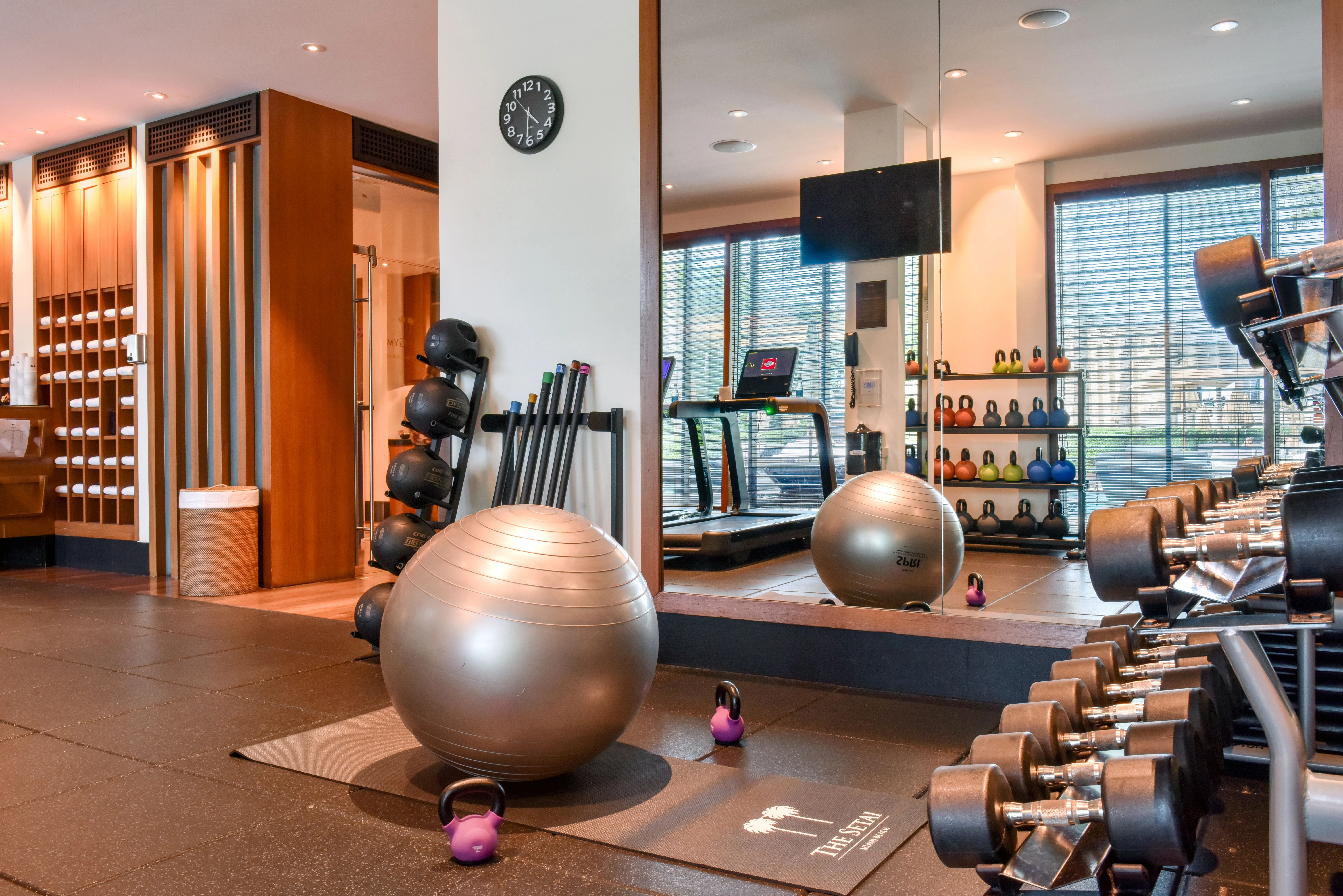 spa fitness center with exercise equipment and weights