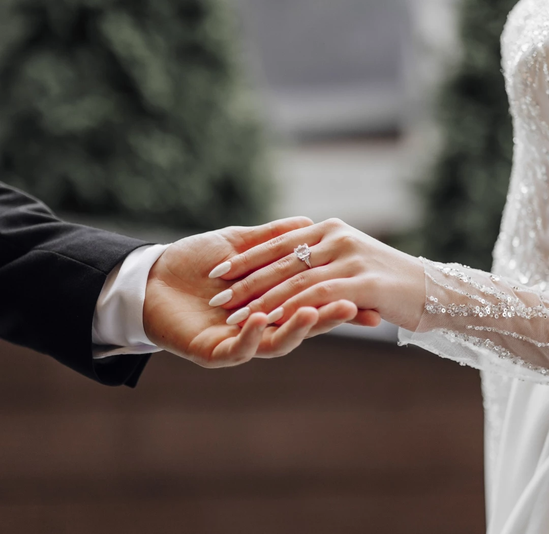 a man and woman holding hands