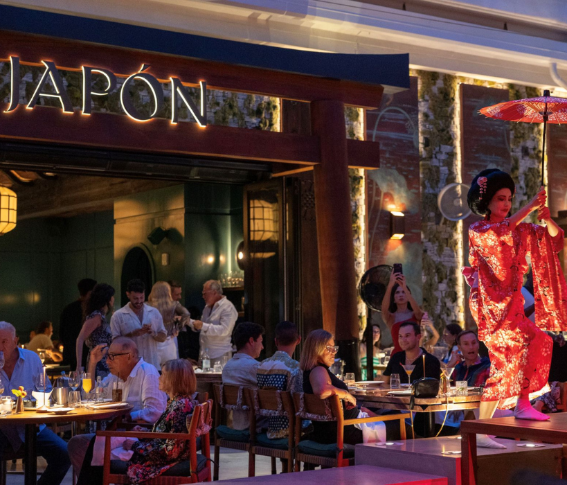a woman in a kimono holding an umbrella