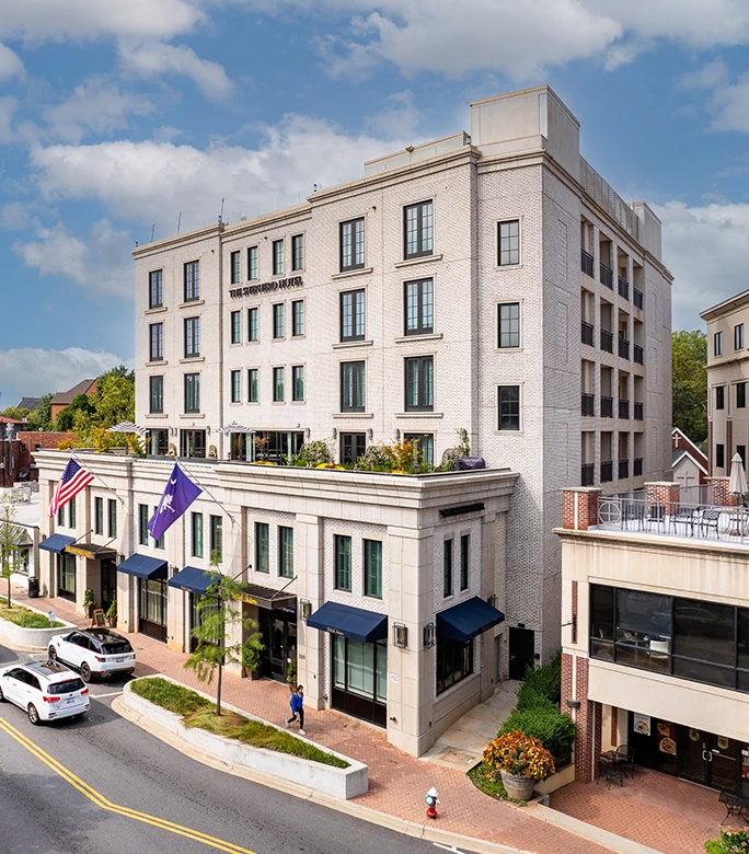 a building with flags on the top of it